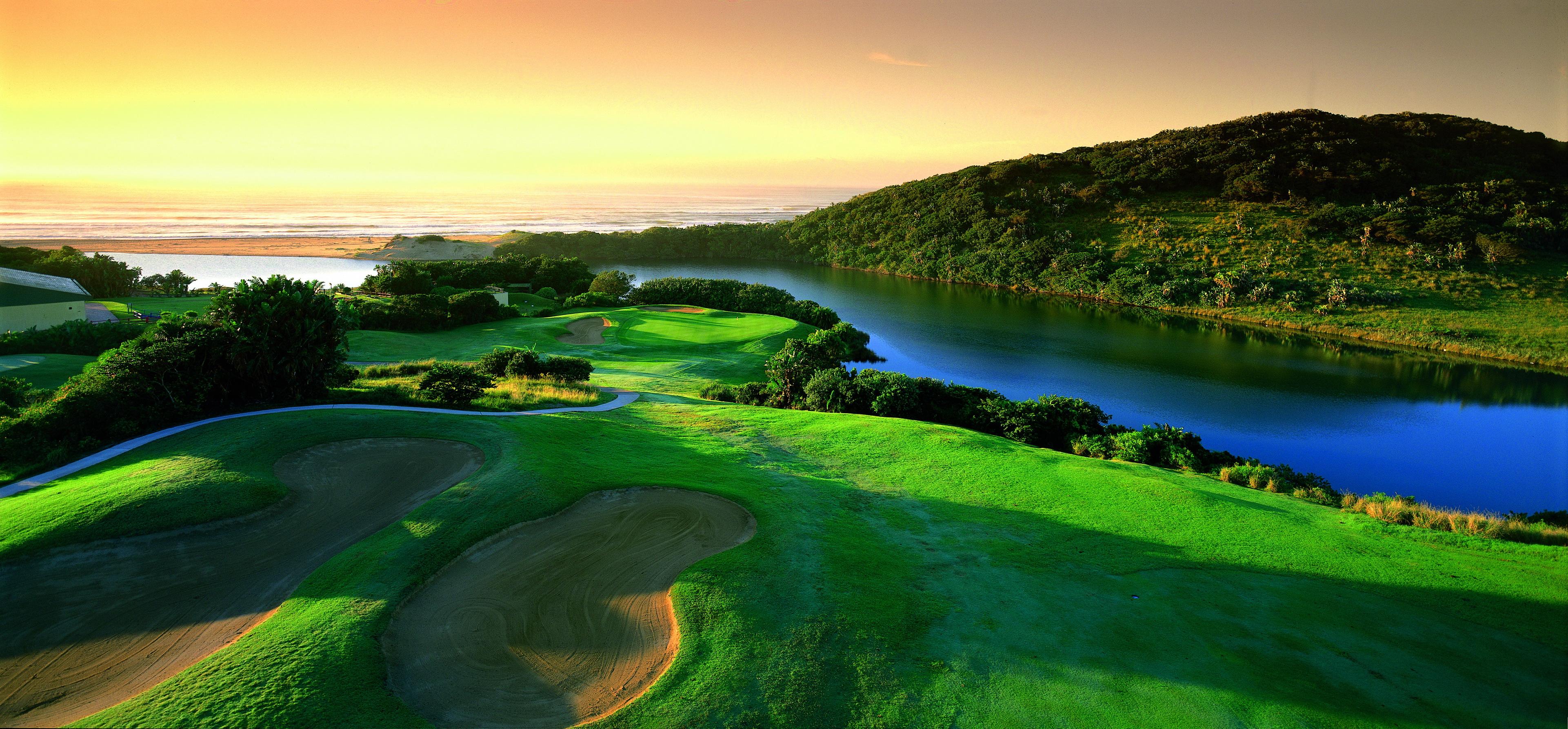 Wild Coast Country Club – 1st hole locally known as Charlies Angels –  Mzamba River in the background golf